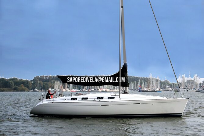 6 hours sailing tour with audio guides and typical Sardinian cuisine - Sailing from Faro into Alghero’s open water