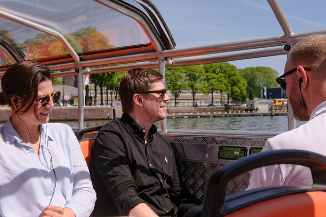 Amsterdam 1h Canal Cruise by Semi-Open Boat with Audio Guide - Munt Tower and the Singel Canal