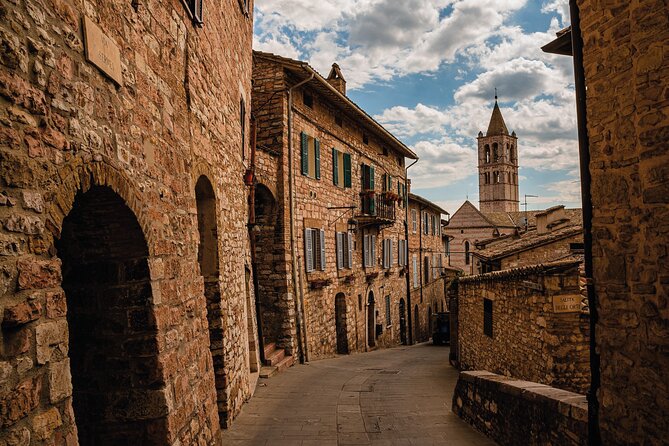 Assisi Walking Tour with Audio and Written Guide by a Local - Santa Chiara begins the walk with a quiet Franciscan contrast