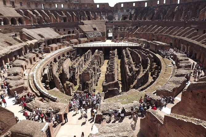 Colosseum, Forum, Palatine Hill with audio guide and Arena or Bus option - Walking through the Roman Forum
