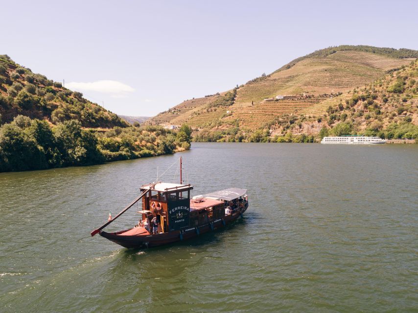 From Pinhão: Douro Valley Rabelo Boat Tour with Audio Guide - Leaving Pinhão beneath the Eiffel Bridge