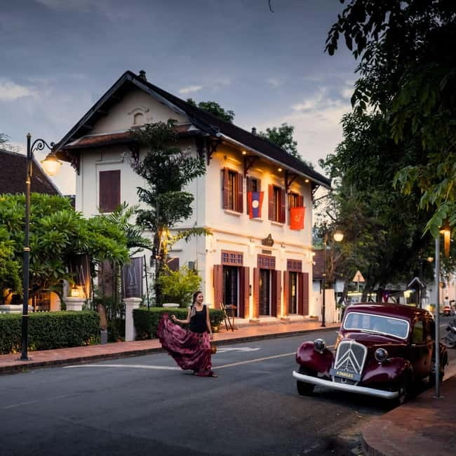 Luang Prabang: Audio-Guided City Tour in Electric Car - French-colonial houses and Lao wooden homes