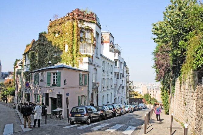 Montmartre Paris Walking Tour with Audioguide on Your Smartphone - The Moulin Rouge and the neighborhood below