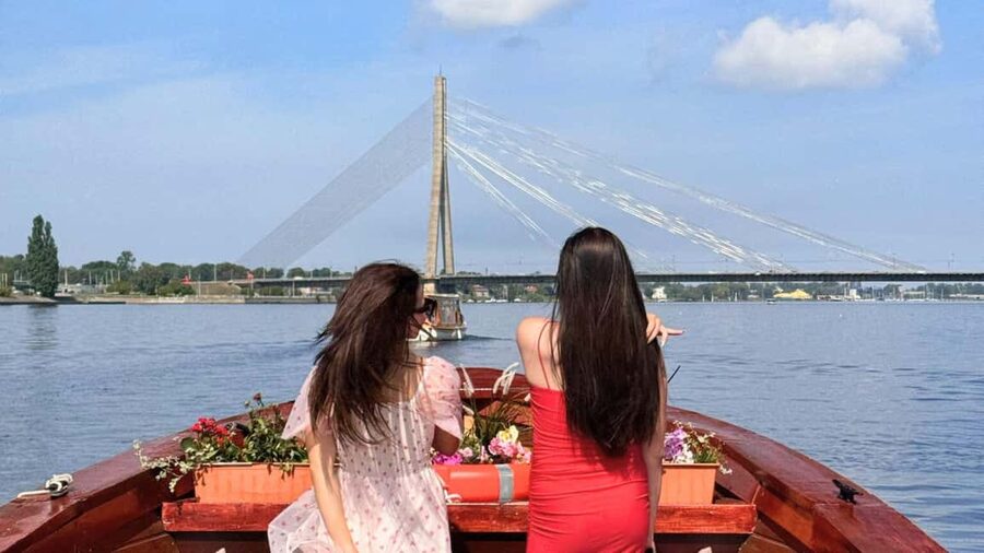 Riga: Canal Boat Tour with Welcome Drink & Audio Guide - The boat, seating, and audio guide