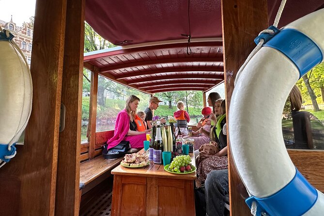 Riga: Evening or Sunset Boat Tour with Drink and Audio Guide - From Andrejosta Marina to Riga’s waterways