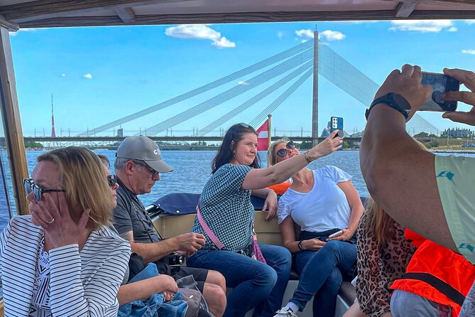 Riga Sightseeing Tour by Canal Boat with Audioguide - Audio guide, captain, and comfort
