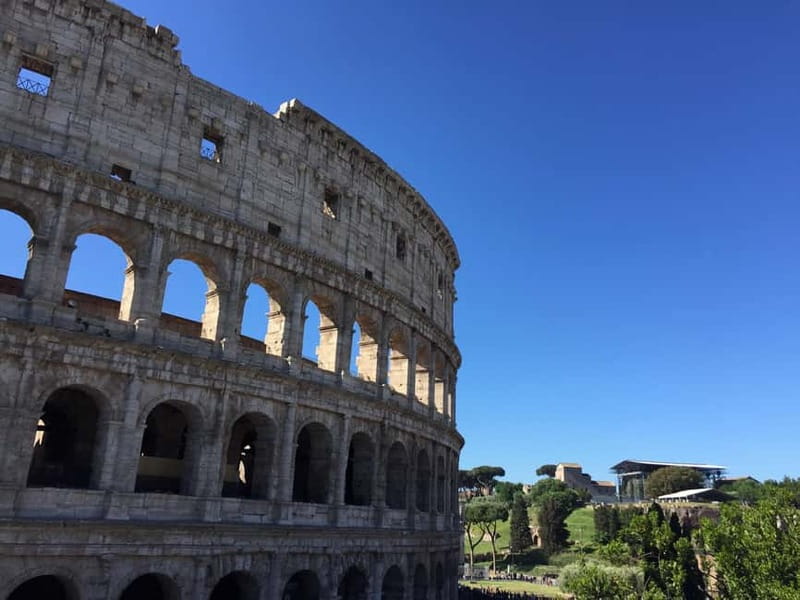 Rome: Mamertine Prison, Colosseum Experience, & Audio Guide - Walking through the Roman Forum