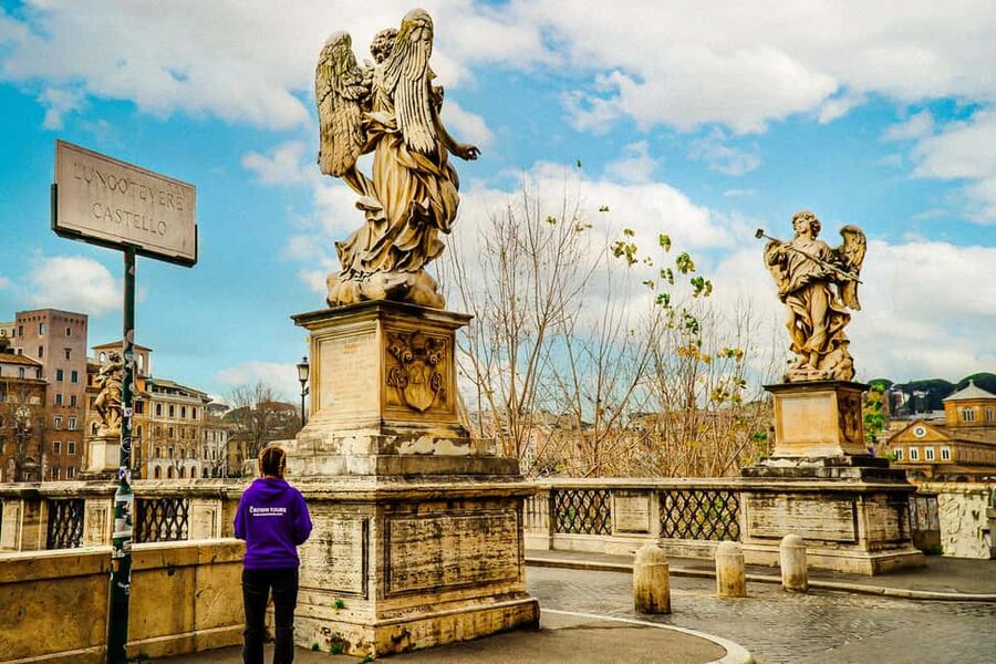 Rome: Skip-the-Line Castel Sant'Angelo Tickets & Audio Guide - Meeting Crown Tours under the angel statue