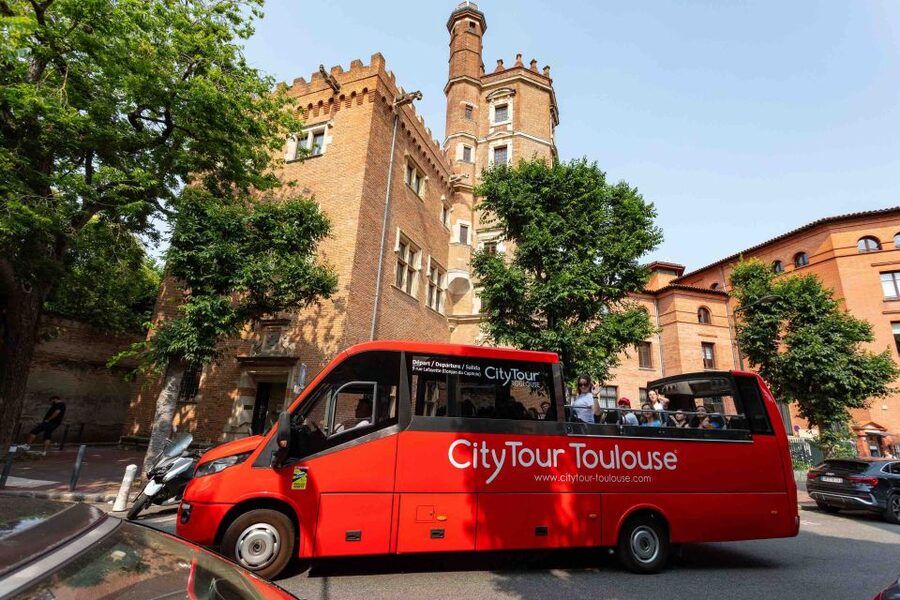 Toulouse: City Sightseeing Tour by Bus with Audio Guide - Saint-Sernin and Toulouse Cathedral from the road